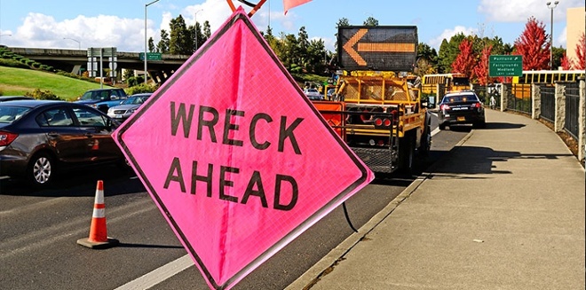 wreck ahead road sign 