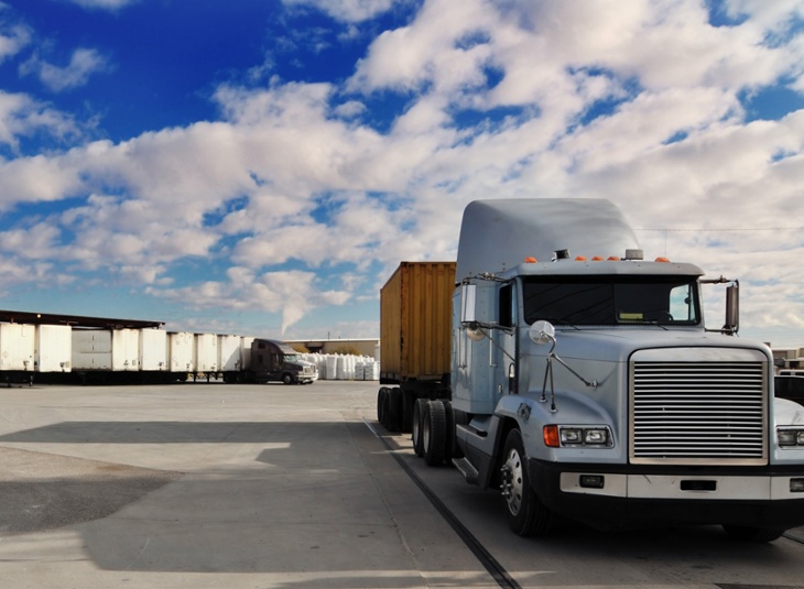 semi truck parked in docking station 