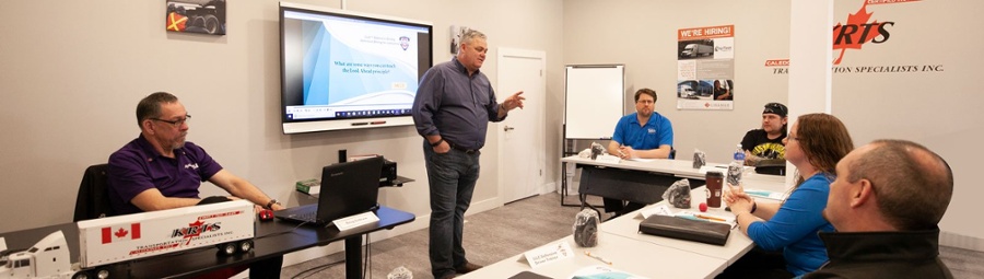 Instructor speaking at the professional driver course