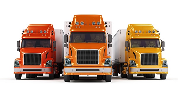 Red, orange and yellow trucks isolated on white background