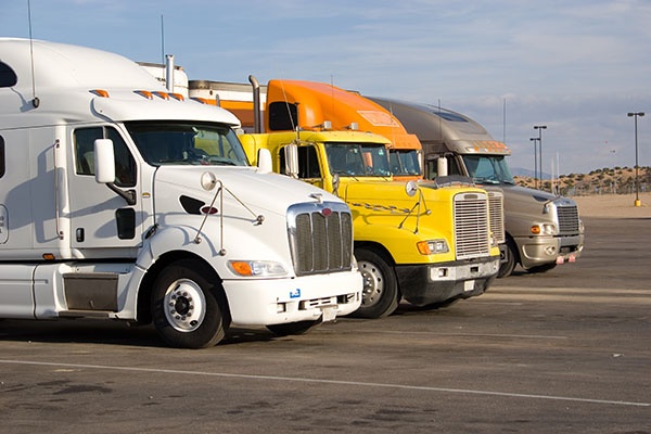 a group of large trucks in a row